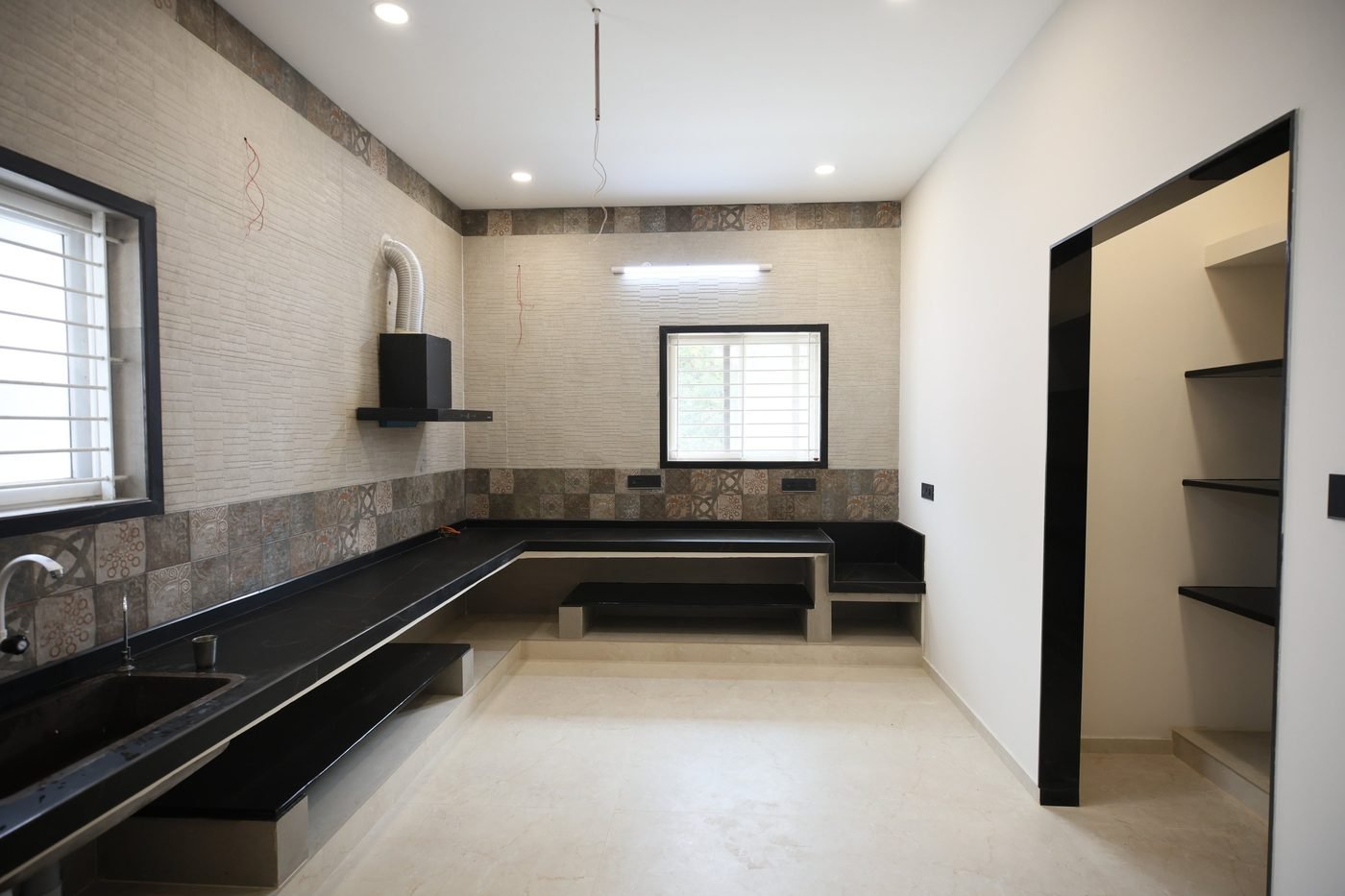 Kitchen with black granite counter
