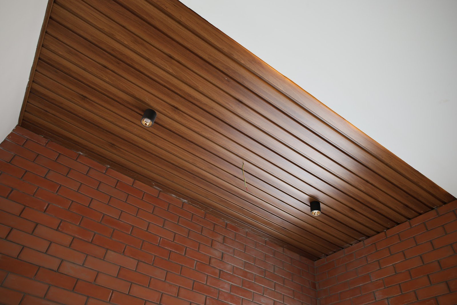 Wooden ceiling and brick wall